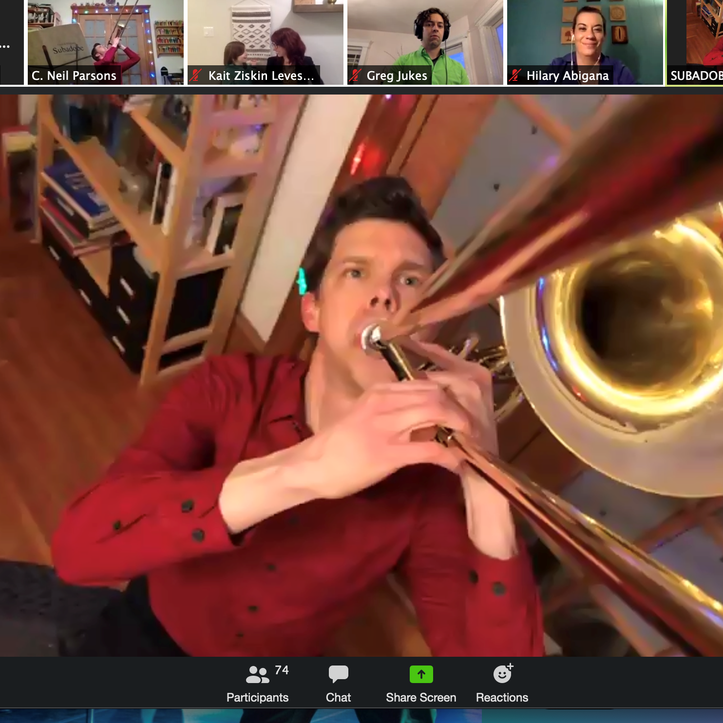 A musician plays a trombone in an online arts education program